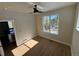 Bright bedroom with beautiful mountain views, ceiling fan and adjacent bathroom at 33884 Bergen View Trl, Evergreen, CO 80439