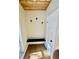 Charming entryway with wood ceiling, built-in bench, coat hooks, and ample storage at 33884 Bergen View Trl, Evergreen, CO 80439