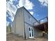 View of the home's exterior with a wooden deck at 33884 Bergen View Trl, Evergreen, CO 80439