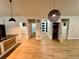 Modern interior with luxury vinyl plank flooring and stylish lighting fixtures at 33884 Bergen View Trl, Evergreen, CO 80439