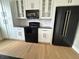 Stylish kitchen with modern appliances, granite countertops, and sleek white cabinetry at 33884 Bergen View Trl, Evergreen, CO 80439