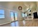 Bright living room boasts wood floors, modern lighting, and a mountain view at 33884 Bergen View Trl, Evergreen, CO 80439