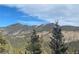 Wonderful view of the mountains among the trees at 33884 Bergen View Trl, Evergreen, CO 80439