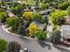 Charming neighborhood with tree-lined streets and well-maintained homes, showcasing a vibrant community at 7055 E Heritage S Pl, Centennial, CO 80111