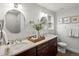Bathroom featuring double vanity, granite countertops and modern fixtures at 7055 E Heritage S Pl, Centennial, CO 80111