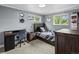 Comfortable bedroom with a desk and a window at 7055 E Heritage S Pl, Centennial, CO 80111