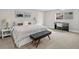 Cozy bedroom with comfortable king bed, piano, soft carpet, and natural light from a large window at 7055 E Heritage S Pl, Centennial, CO 80111
