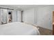 This is a bedroom with light blue walls and two closets at 7055 E Heritage S Pl, Centennial, CO 80111