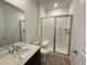 Clean bathroom with a walk-in shower, a toilet, and a vanity at 4664 Windmill Dr, Thornton, CO 80601