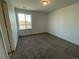 Bright bedroom with carpet and a window offering natural light at 4664 Windmill Dr, Thornton, CO 80601