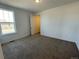 Simple bedroom with carpeted floors and a window at 4664 Windmill Dr, Thornton, CO 80601