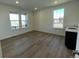 Bright bonus room with hardwood floors and a wet bar at 4664 Windmill Dr, Thornton, CO 80601