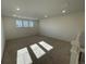 Large loft bedroom with carpeted floor and great natural light at 4664 Windmill Dr, Thornton, CO 80601