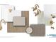 Bathroom design showcasing brushed gold fixtures, white tiles, and wood flooring at 2261 Peregrine Dr, Brighton, CO 80601