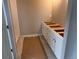Bathroom with white cabinets, a tiled shower, and light beige walls at 2261 Peregrine Dr, Brighton, CO 80601