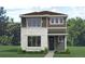 Charming two-story home with stone and siding accents surrounded by lush landscaping at 2261 Peregrine Dr, Brighton, CO 80601
