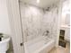 Bright bathroom features tub-shower with modern tile surround and updated fixtures at 14006 E Stanford Cir # K08, Aurora, CO 80015