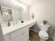 Bathroom with vanity, with a large mirror and modern lighting fixtures at 14006 E Stanford Cir # K08, Aurora, CO 80015