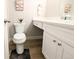 Powder room featuring a white vanity with storage and a modern toilet at 14006 E Stanford Cir # K08, Aurora, CO 80015