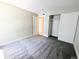 Bedroom with ensuite bathroom and large sliding door closet at 14006 E Stanford Cir # K08, Aurora, CO 80015