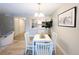 Inviting dining area with open floor plan, kitchen access, and stylish décor at 14006 E Stanford Cir # K08, Aurora, CO 80015