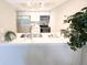 Well-equipped kitchen boasting stainless appliances, white cabinets, and modern countertops at 14006 E Stanford Cir # K08, Aurora, CO 80015
