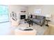 Cozy living room with a fireplace, comfortable seating, and lots of natural light at 14006 E Stanford Cir # K08, Aurora, CO 80015