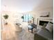 Spacious living room featuring a fireplace, contemporary décor, and sliding glass doors at 14006 E Stanford Cir # K08, Aurora, CO 80015