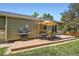 Charming backyard featuring a patio with comfortable seating, a grill, and lush greenery at 10762 W 54Th Pl, Arvada, CO 80002