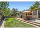 Backyard patio with outdoor seating and a grill, perfect for entertaining and summer cookouts at 10762 W 54Th Pl, Arvada, CO 80002