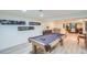 Spacious basement game room with a pool table, stylish decor, and entertainment area at 10762 W 54Th Pl, Arvada, CO 80002