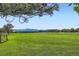 Expansive green space with scenic mountain views creating a peaceful backdrop at 10762 W 54Th Pl, Arvada, CO 80002