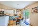 Eat-in kitchen with stainless appliances and sliding door access to the backyard patio at 10762 W 54Th Pl, Arvada, CO 80002