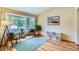 Cozy living room featuring hardwood floors, ample natural light, and modern decor at 10762 W 54Th Pl, Arvada, CO 80002