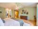 Bright main bedroom with en-suite bathroom, multiple windows and neutral color palette at 10762 W 54Th Pl, Arvada, CO 80002