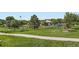 Beautiful park view with playground and walking path amid lush greenery at 10762 W 54Th Pl, Arvada, CO 80002
