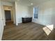 Finished basement with wet bar and light wood floors at 12937 Range St, Firestone, CO 80504