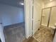 Bathroom with shower, toilet and gray tile floor at 12937 Range St, Firestone, CO 80504