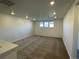 Spacious loft area with neutral carpeting and multiple windows at 12937 Range St, Firestone, CO 80504