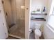 Modern bathroom featuring walk-in glass shower and floating wood shelves at 1884 Ford St, Golden, CO 80401