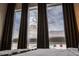 Bedroom with three large windows offering exterior views and streaming sunlight at 1884 Ford St, Golden, CO 80401