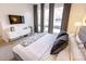 Comfortable bedroom featuring large windows, modern decor and streaming sunlight at 1884 Ford St, Golden, CO 80401