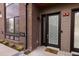 Close-up of the home's exterior, featuring a modern front door with a decorative pattern, brick accents, and sleek design at 1884 Ford St, Golden, CO 80401