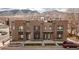 Exterior of newly built townhomes with modern design and attractive landscaping in a desirable urban location at 1884 Ford St, Golden, CO 80401