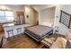 Open concept living and dining area with hardwood floors, large island, and a murphy bed at 1884 Ford St, Golden, CO 80401