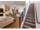 Open-concept living room featuring hardwood floors, modern decor, and seamless flow to the kitchen area at 1884 Ford St, Golden, CO 80401