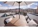 Rooftop deck featuring covered patio dining set with mountain views at 1884 Ford St, Golden, CO 80401