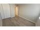 Cozy bedroom with updated floors, closet doors, and neutral walls at 10890 W Evans Ave # 2E, Lakewood, CO 80227