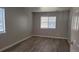 Inviting bedroom with natural light from window and updated floors at 10890 W Evans Ave # 2E, Lakewood, CO 80227