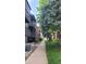 Apartment complex features well-maintained landscaping and mature trees at 10890 W Evans Ave # 2E, Lakewood, CO 80227